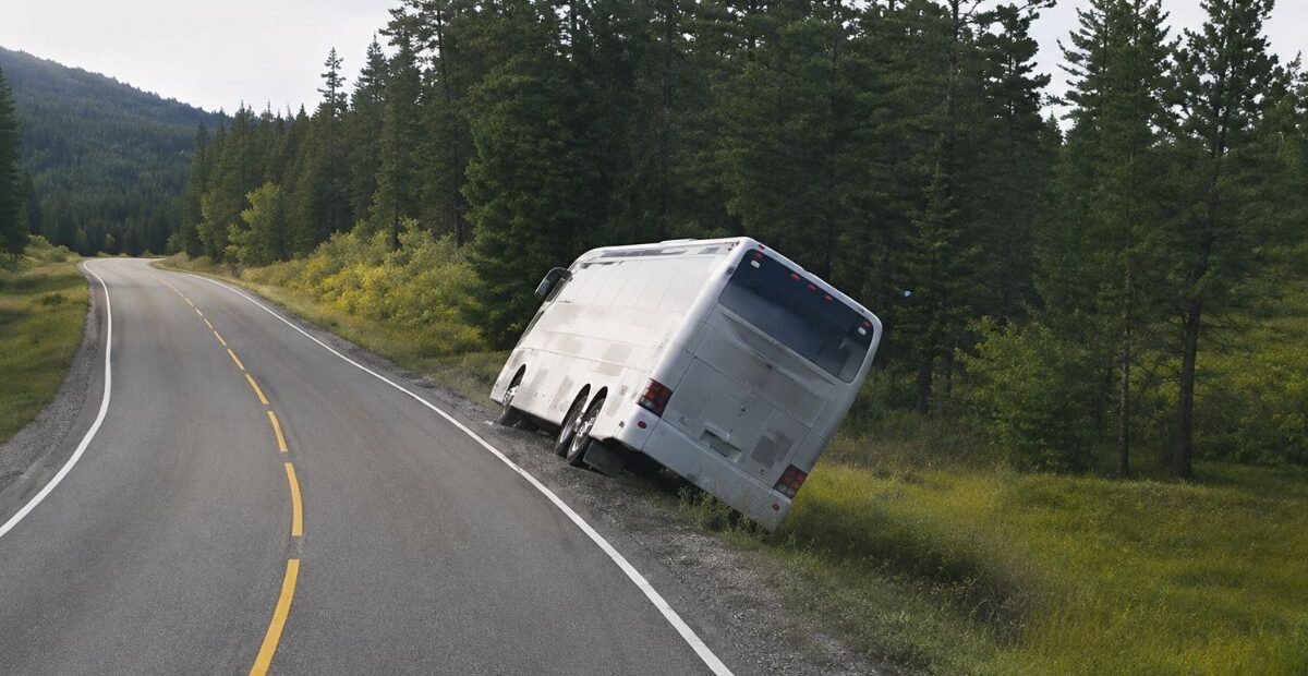 Four Hospitalized After Tourist Bus Overturns Into Ditch